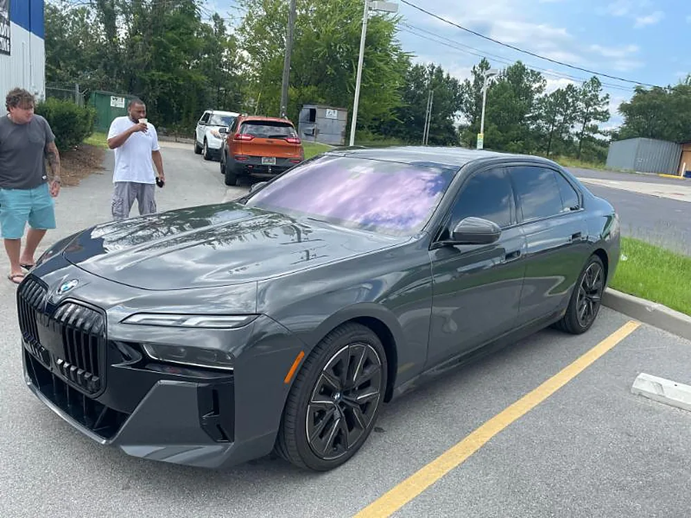 Grey BMW 7 Series with tinted windows