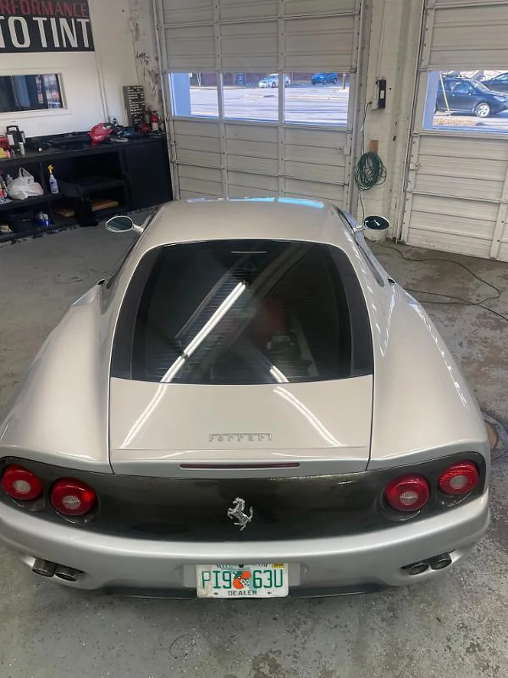Silver Ferrari 360 inside the tint bay