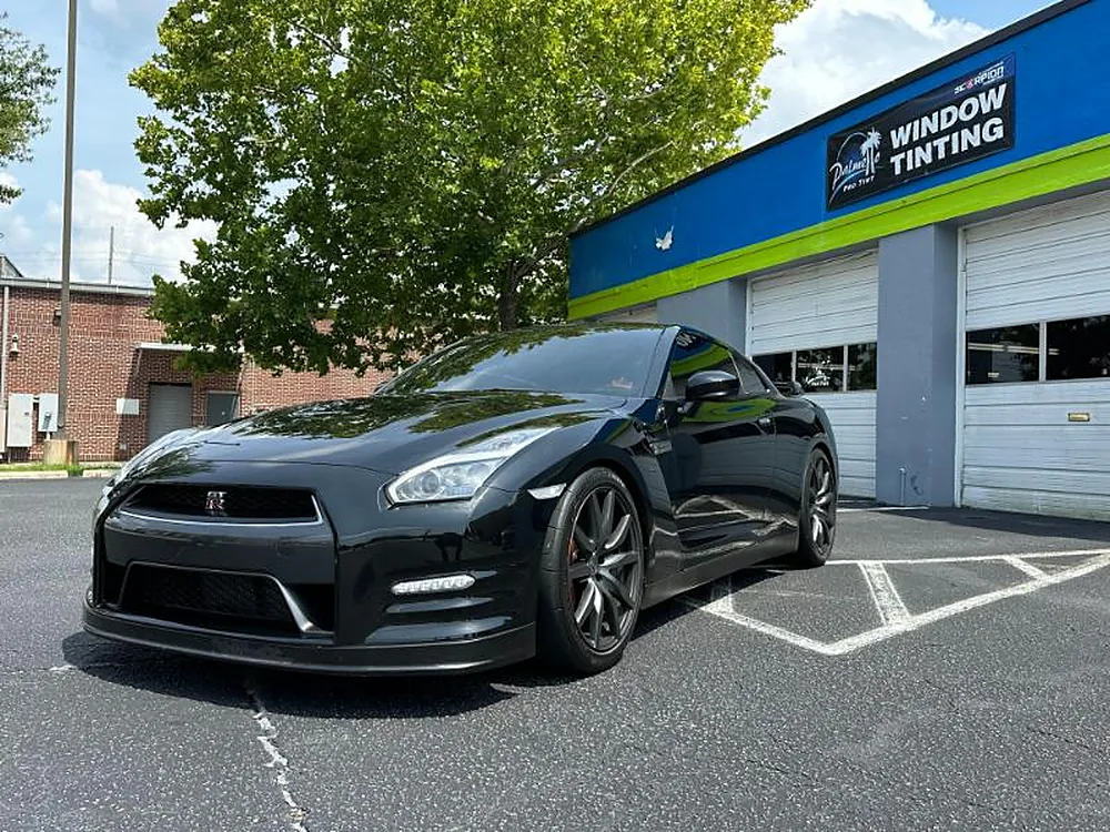 Black Nissan GT-R outside the shop