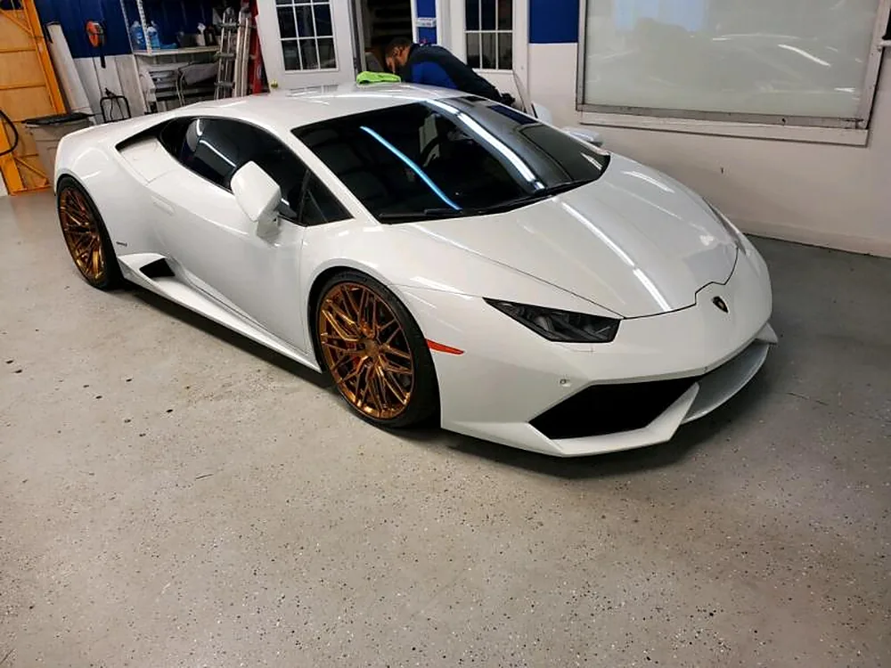 White Lamborghini Huracán with freshly tinted windows