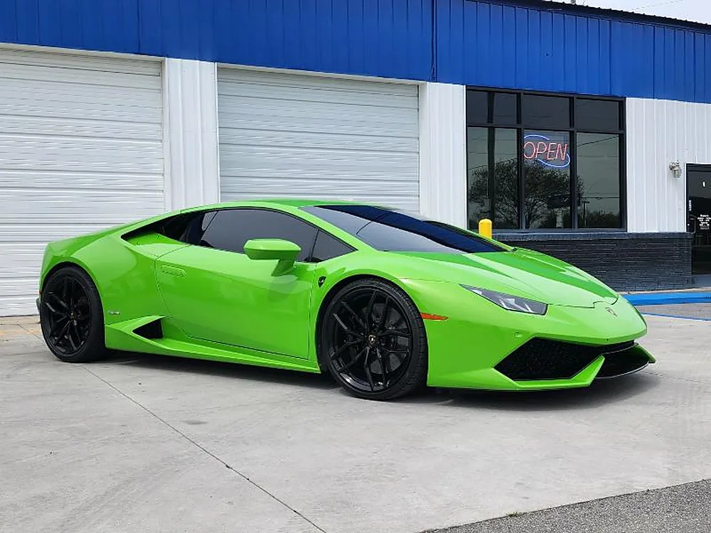 Green Lamborghini outside the shop