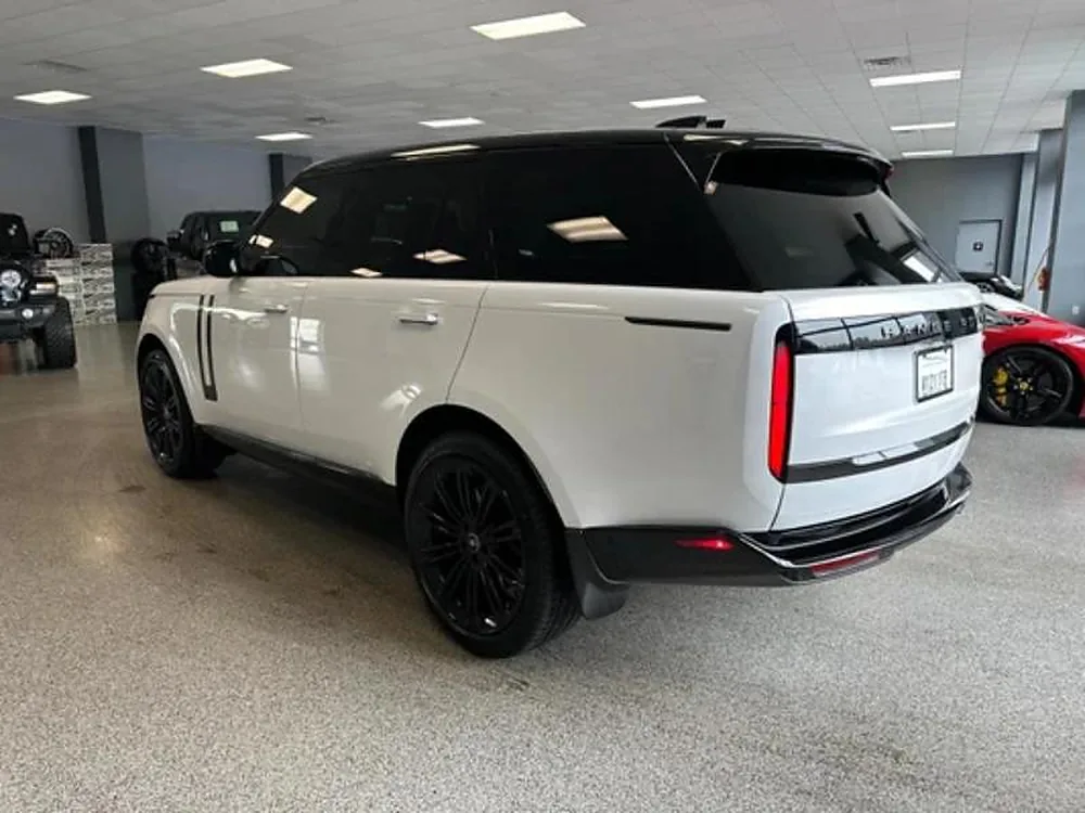 White Range Rover with dark rear glass