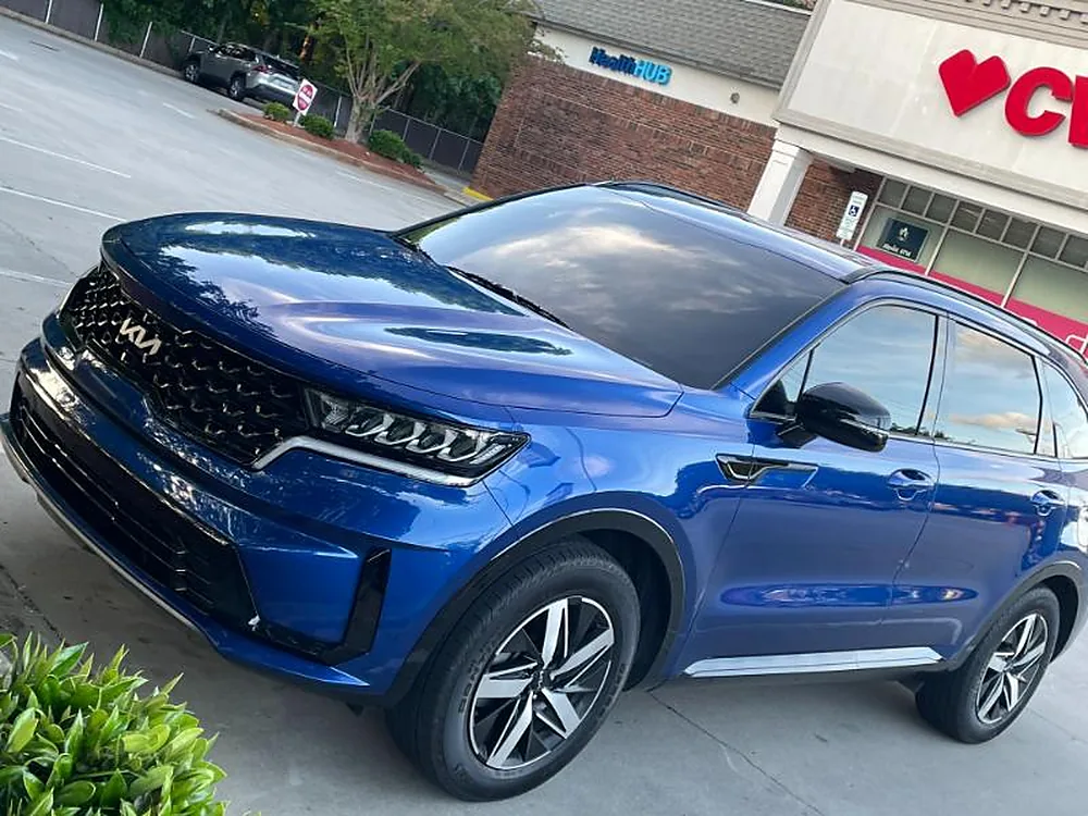Blue Kia Telluride with tinted windows