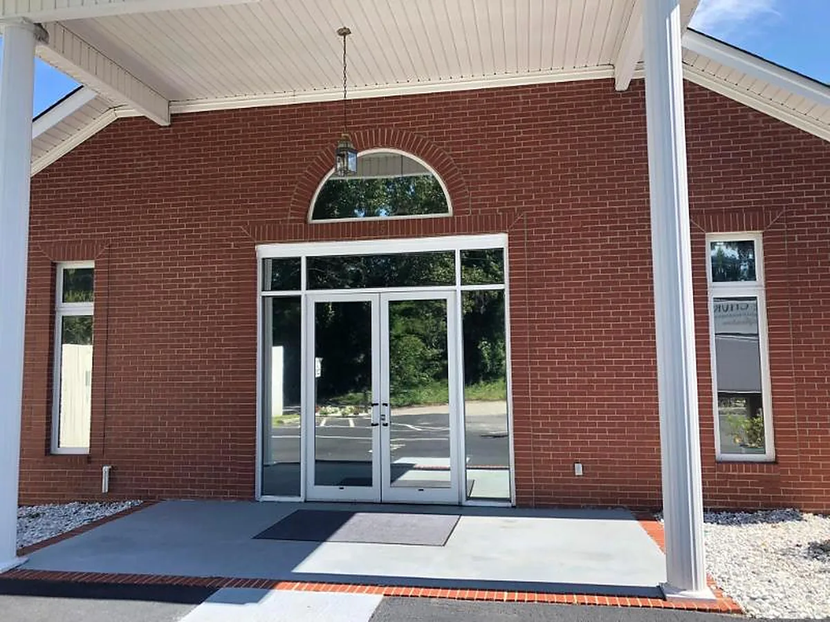 Brick building entrance with glass doors