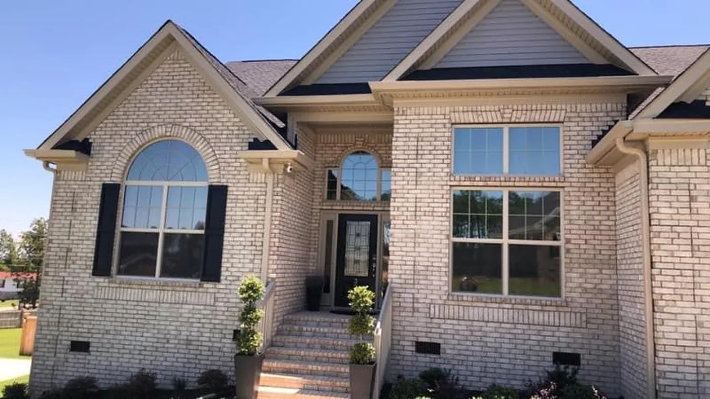 Brick home with large windows